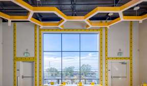 Room with yellow hexigon shapted ceiling lights