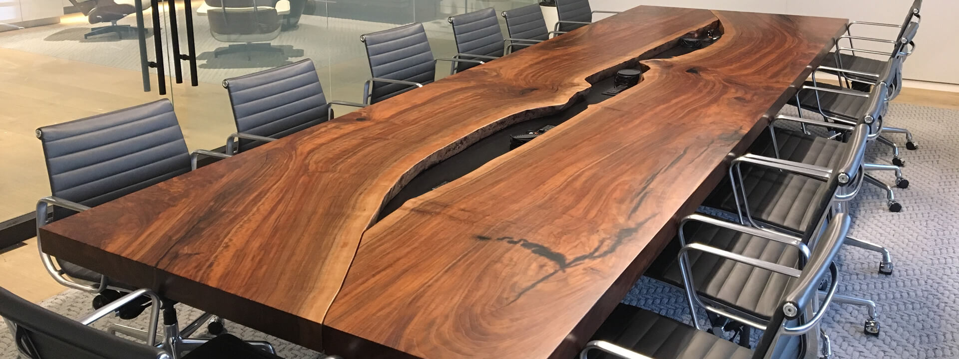 A conference room at LWG Construction Wildcat, featuring a spacious table surrounded by chairs.